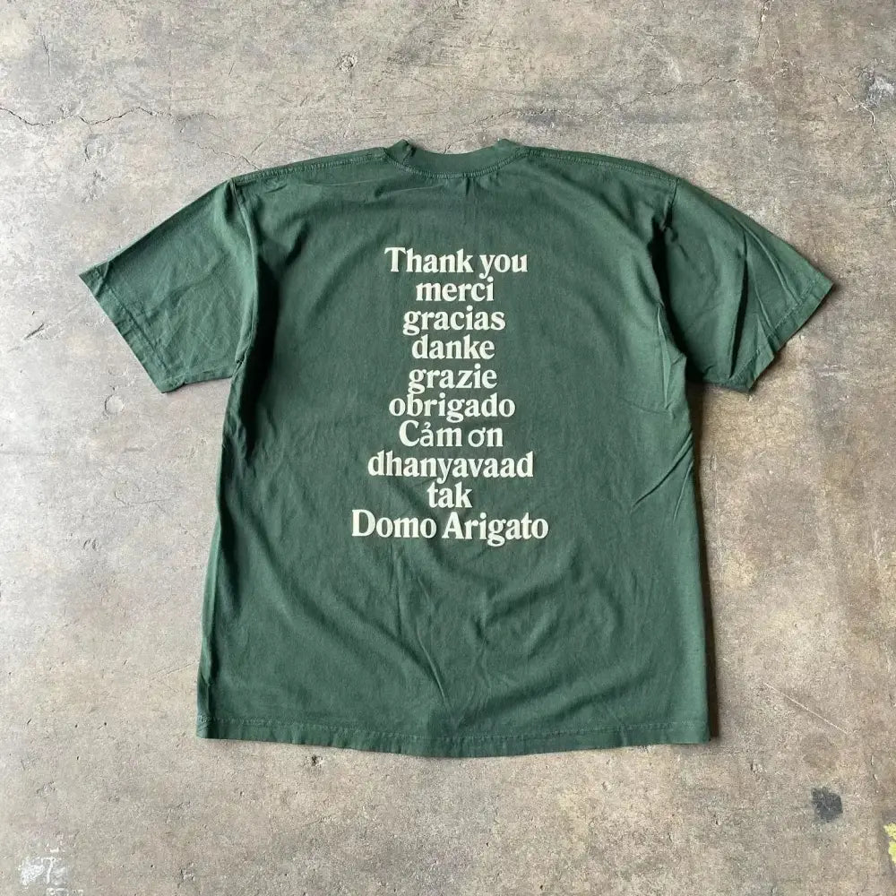 Dark green y2k cotton anime graphic t-shirt with vertical white multilingual thank-you text print