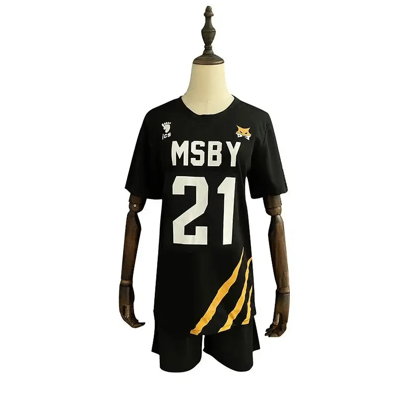 Black short-sleeved volleyball jersey with white msby 21 lettering gold tiger stripes and fox logo for nekoma high school