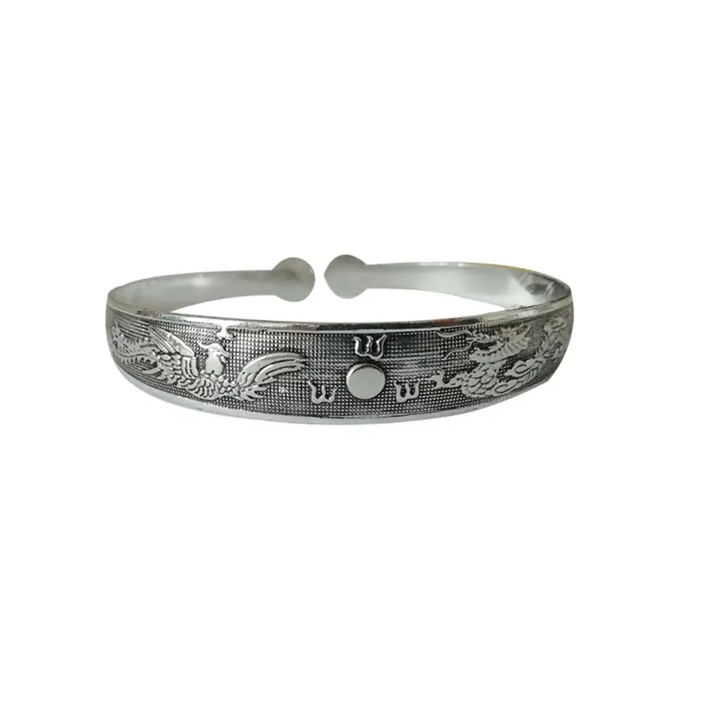Silver dragon and phoenix engraved tibetan silver retro cuff bracelet with central circular motif in metal
