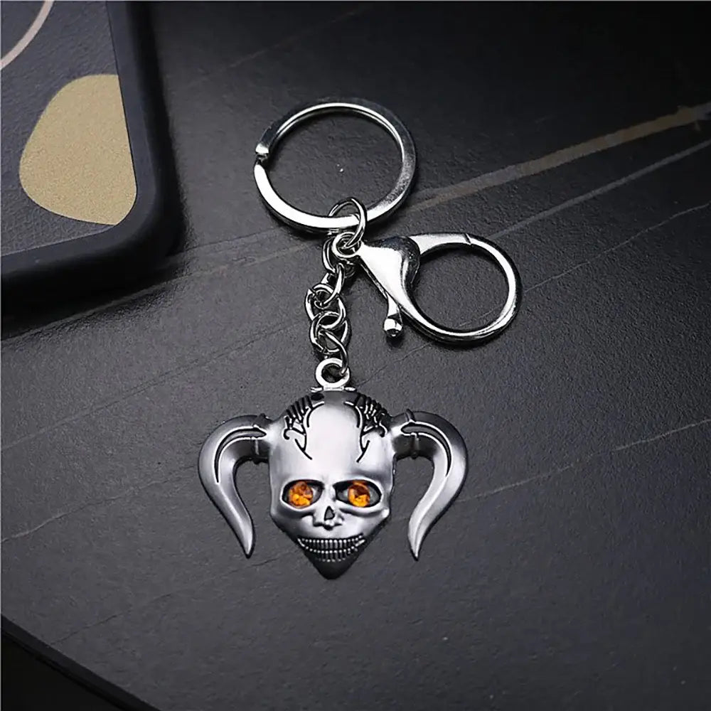 Silver metal ichigo hollow mask keychain with orange gemstone eyes and devil horns for bleach ichigo hollow fans