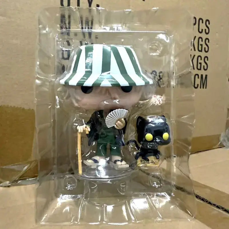 Funko pop figure of urahara kisuke in green and white hat holding fan and cane with yoruichi shihouin black cat