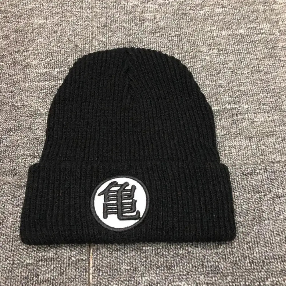Black knitted cuffed beanie with dragon ball embroidery featuring white patch and japanese kanji character for winter wear