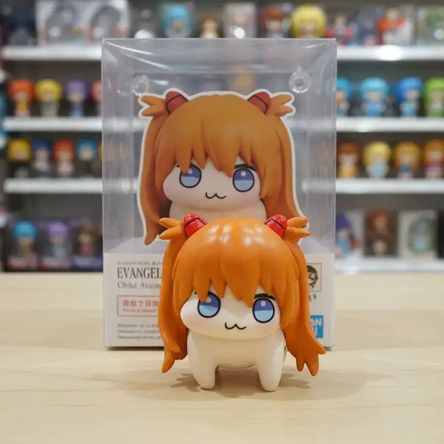 Orange-haired chibi-style evangelion asuka figure 5cm pvc desktop ornament with blue eyes and red horns in clear plastic packaging