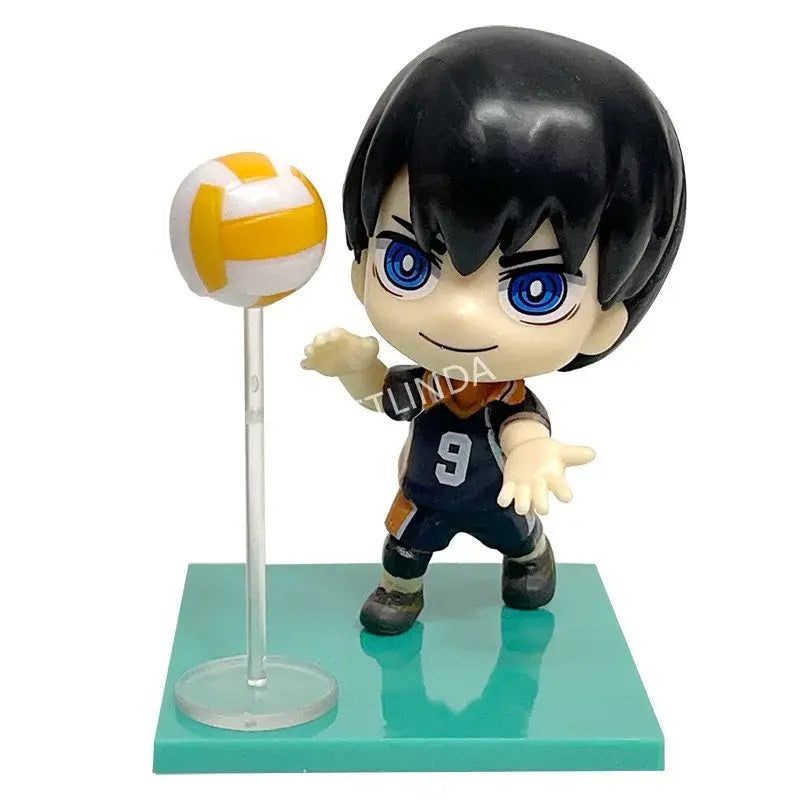 Chibi-style haikyuu shoyo hinata pvc figurine with black hair blue eyes navy jersey 9 posed beside yellow white volleyball