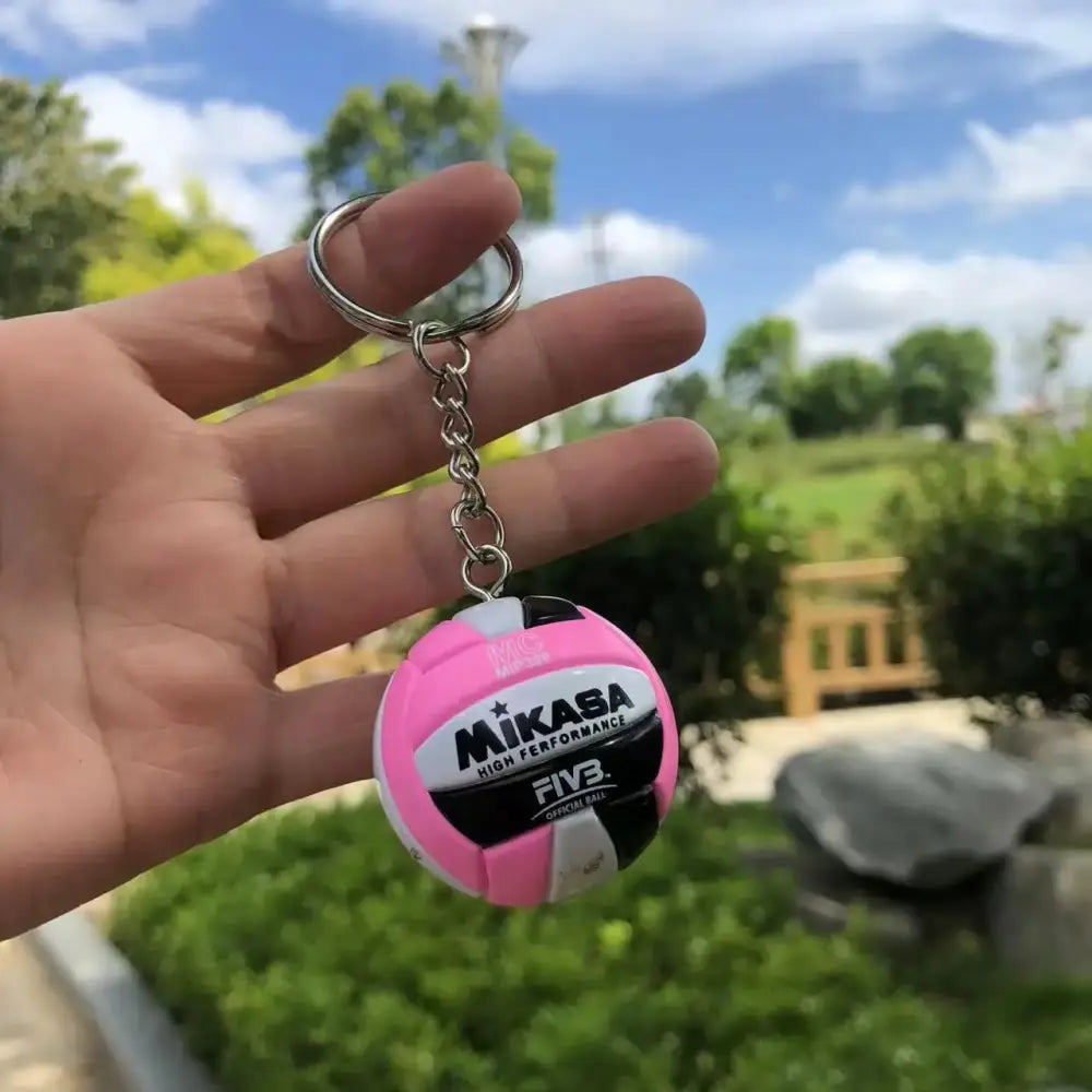 Pink and black mikasa volleyball pvc keychain with white accents from haikyuu sport ball design pvc keychain