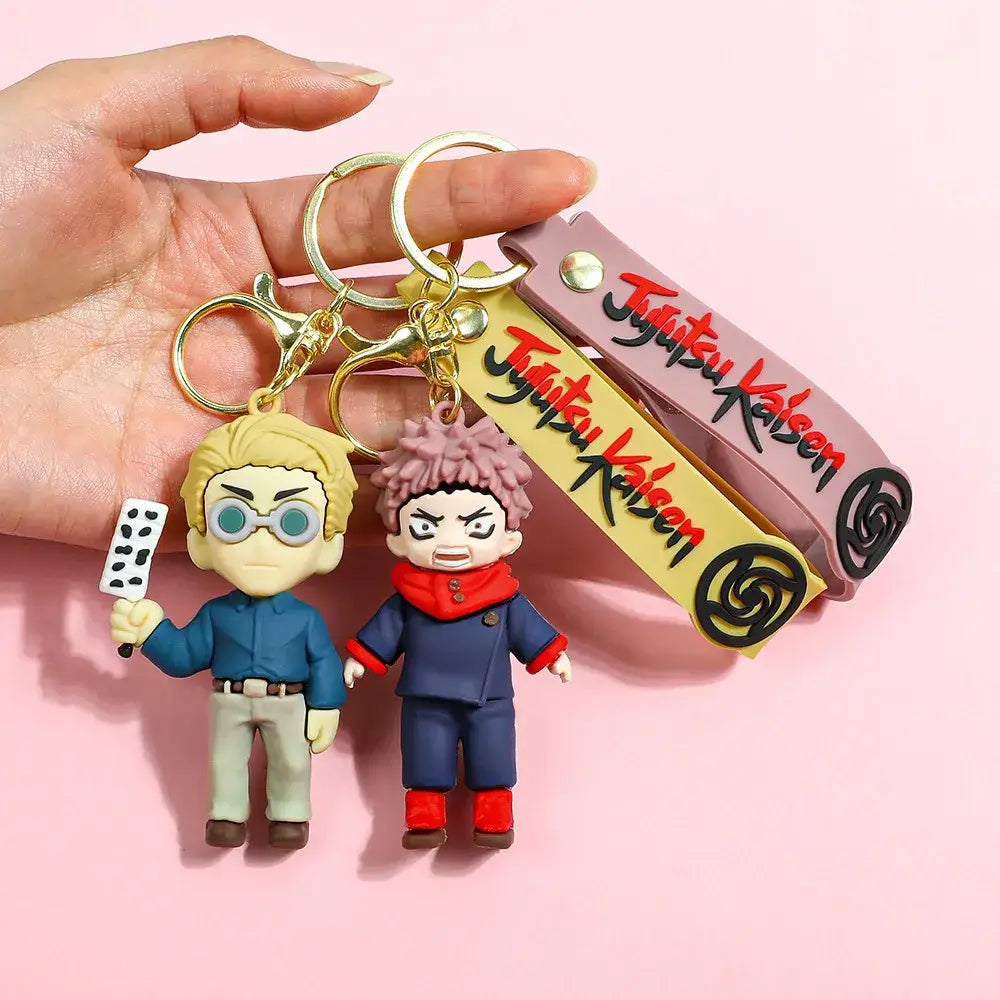 Two jujutsu kaisen gojo satoru plush keychains with molded plastic figures and gold-toned metal rings for backpacks