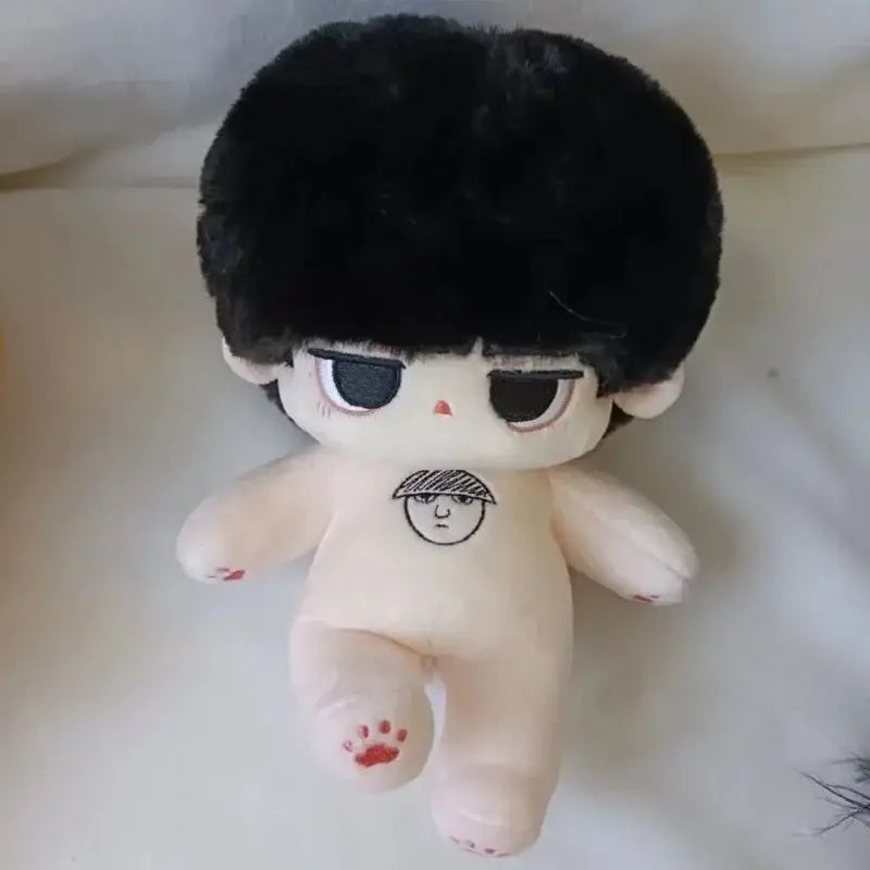 Cute beige plush doll with black fluffy hair and chest tattoo styled face from mob psycho reigen arataka cosplay plush