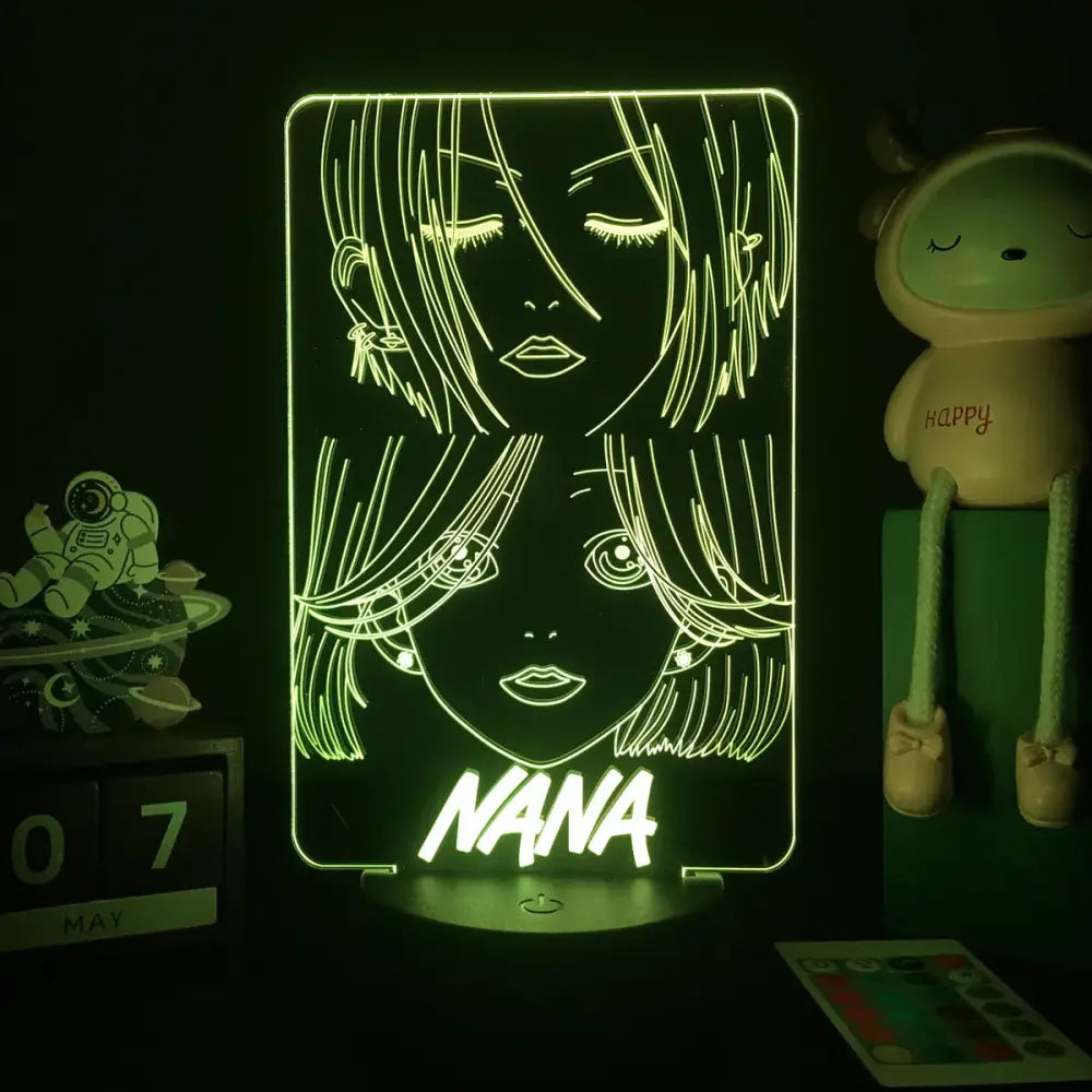 Green neon-lit nana osaki 3d led night light featuring illuminated line-art faces with remote control light lamp