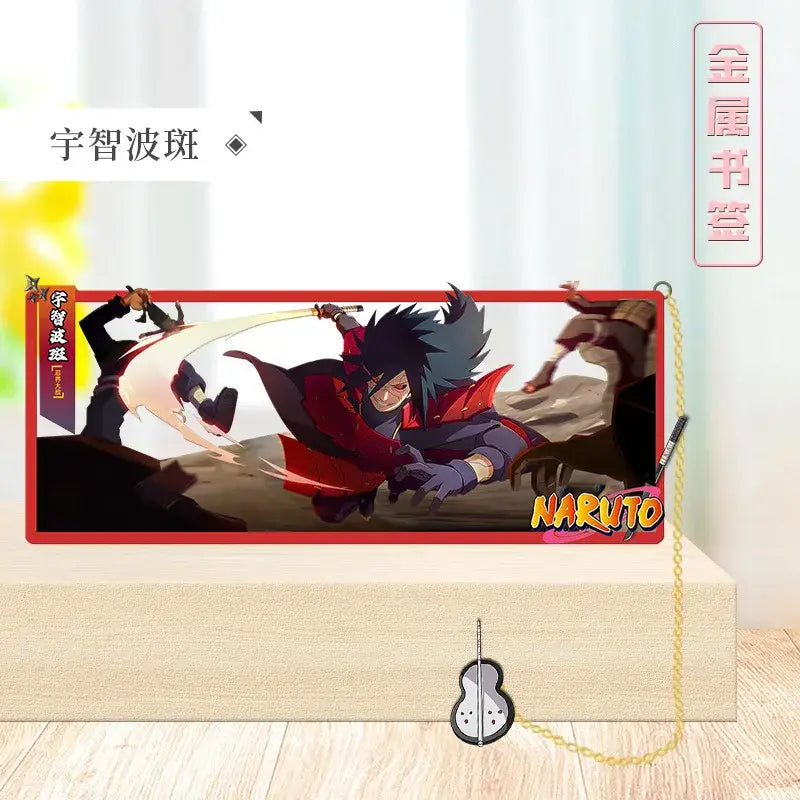 Red-bordered rectangular metal bookmark featuring sasuke uchiha from naruto with gold chain and pendant collector’s design