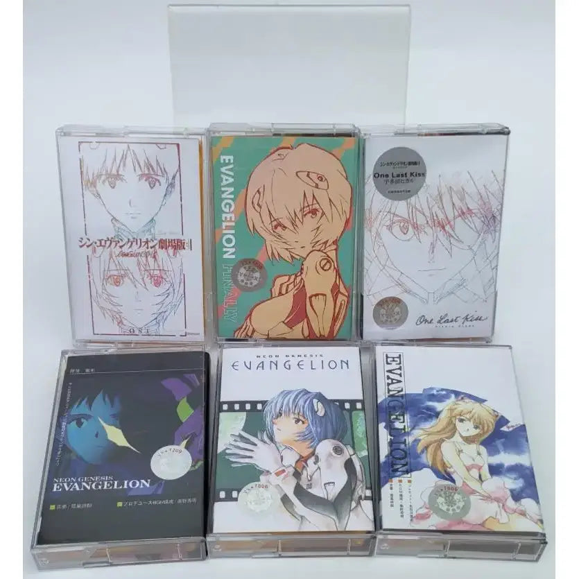 Six clear plastic cassette tapes featuring anime artwork of asuka langley soryu from neon genesis evangelion titled one last kiss soundtrack
