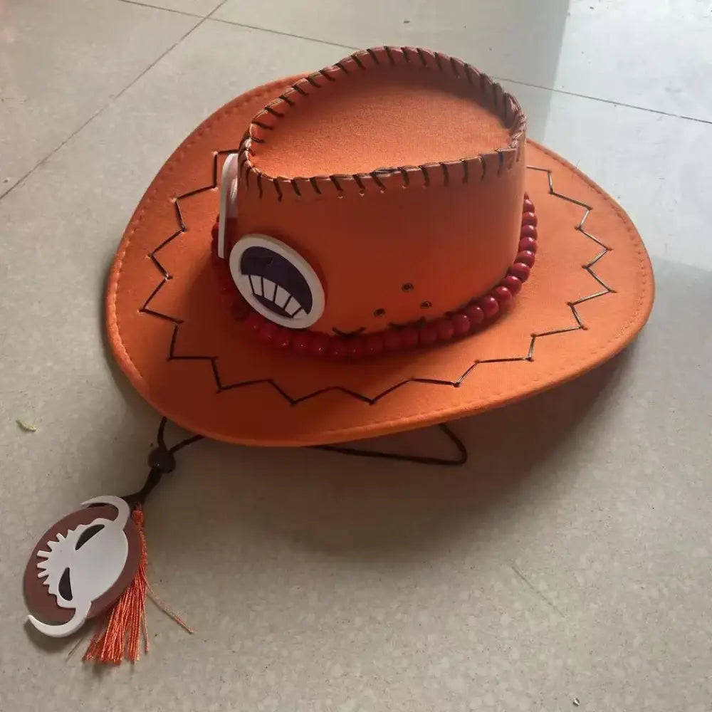 Orange portgas d ace cowboy cap with stitched brim cartoon eye patch and red beaded trim unisex fit
