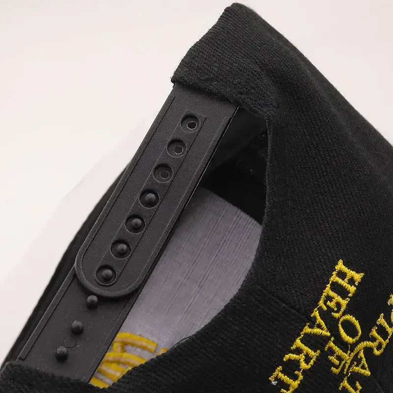 Black snapback cap with gold embroidered text and black plastic adjustable strap for one piece tony tony chopper fit