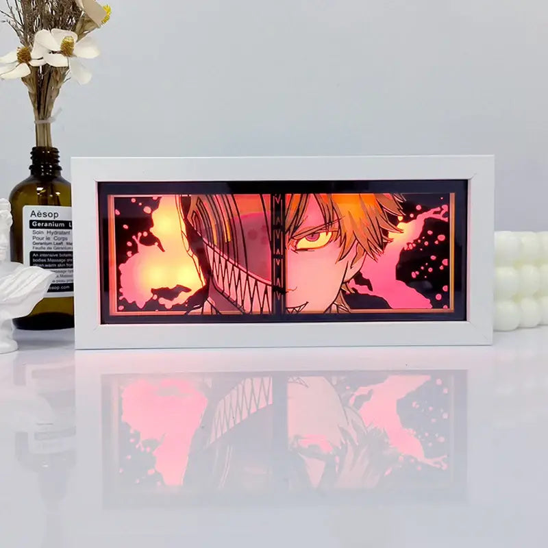 White-framed one piece zoro paper cut shadow box light with illuminated split anime characters in pink and orange box light