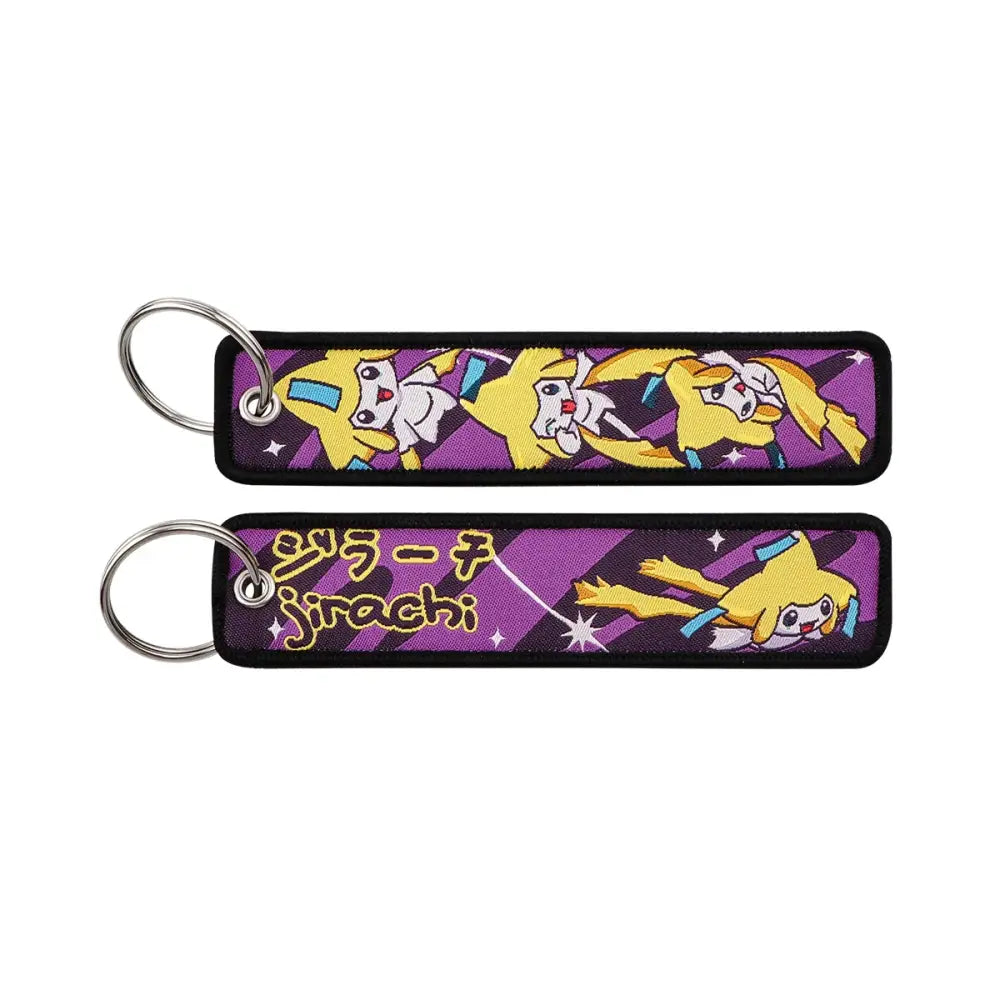 Purple embroidered pokemon pikachu keychain featuring yellow jirachi characters with black trim and silver metal ring