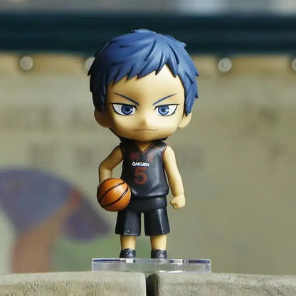 Chibi-style pvc figurine of kuroko tetsuya from kuroko’s basketball with blue hair and black qakuin 5 jersey holding basketball