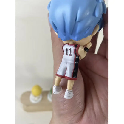 Back view of a blue-haired pvc anime basketball player figurine number 11 delivered intact in retail box