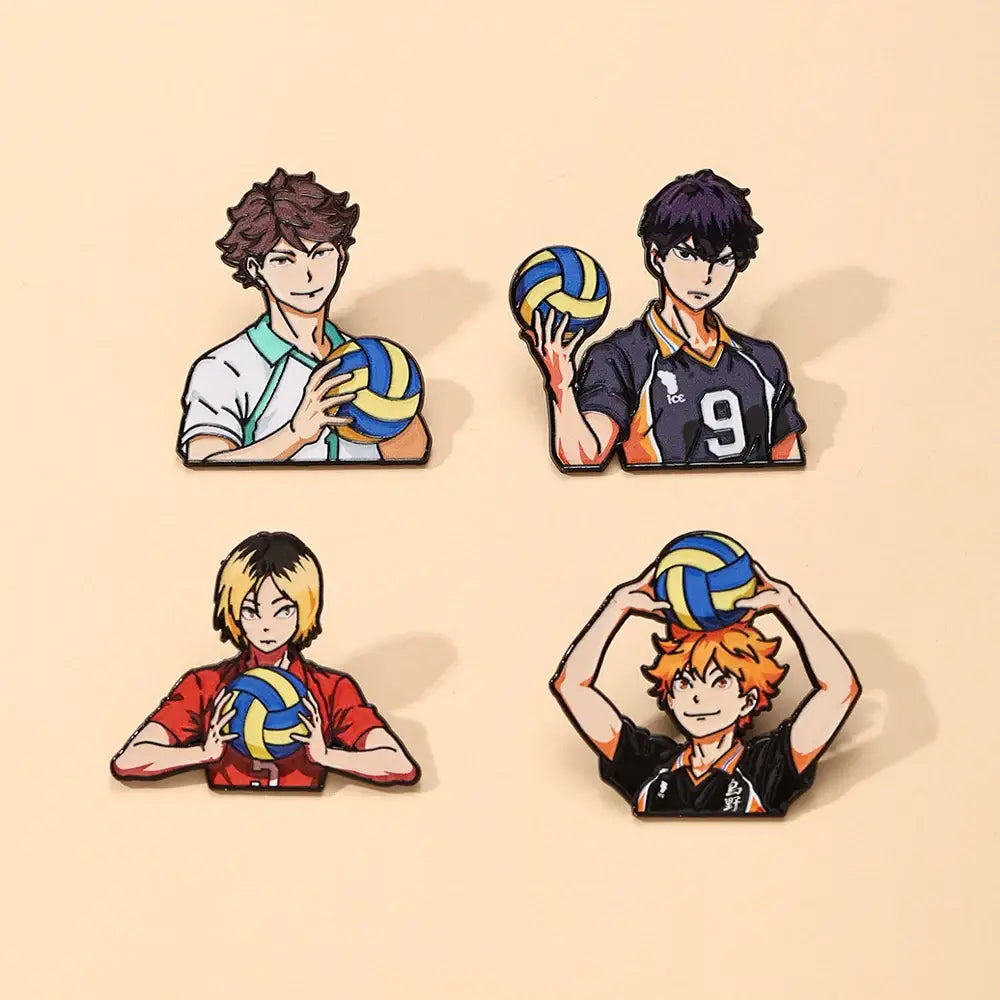 Four anime-style enamel pins of volleyball boys in colorful uniforms holding blue and yellow volleyballs for lapel badges