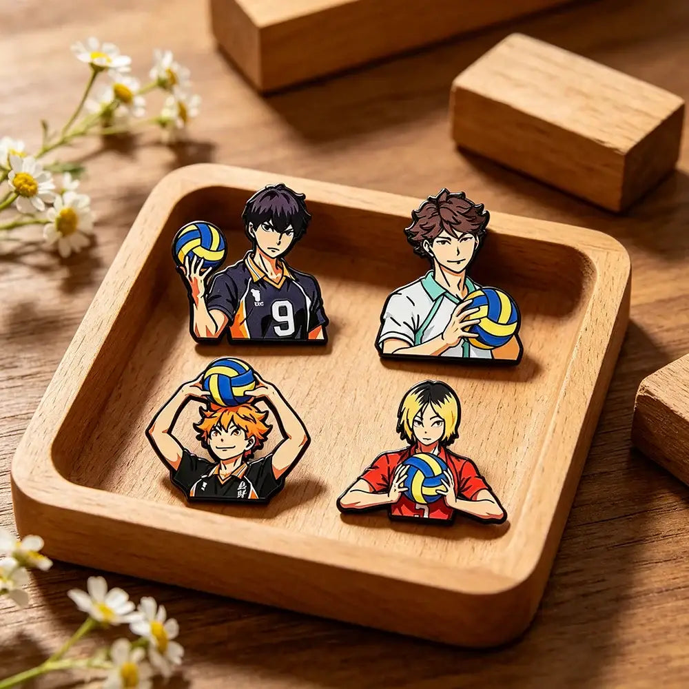 Set of four colorful anime volleyball player enamel pins on wooden tray perfect for coat lapel badges gift