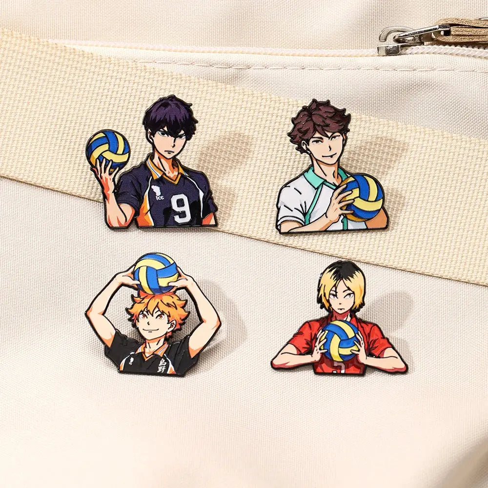 Four colorful anime volleyball player enamel pins featuring cartoon boys in various poses and uniforms for lapel badges