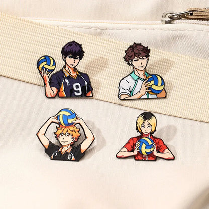 Four colorful anime volleyball player enamel pins featuring cartoon boys in various poses and uniforms for lapel badges