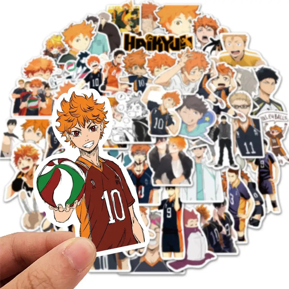 A hand holds a vibrant orange-haired anime haikyuu sticker with number 10 from a 50pcs waterproof decal set for laptops and toys