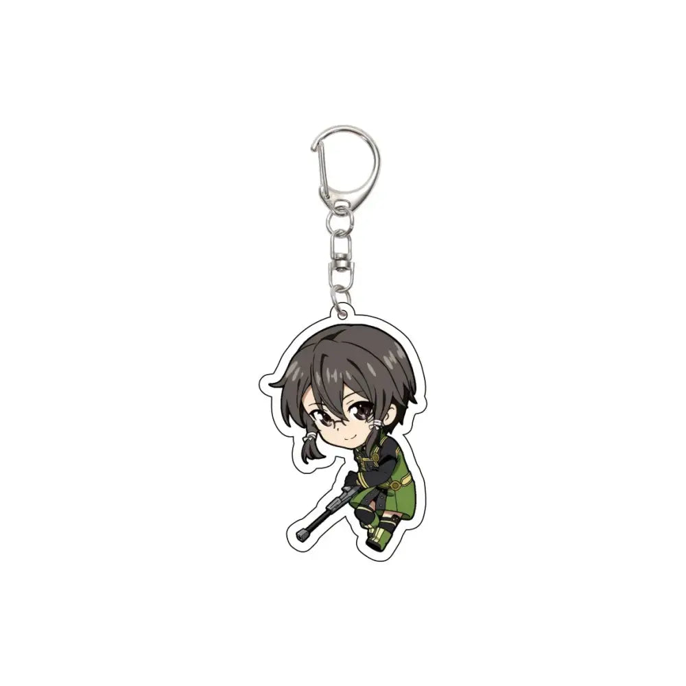 Chibi-style acrylic keychain featuring character with short brown hair and green tactical gear holding rifle attached to silver clip