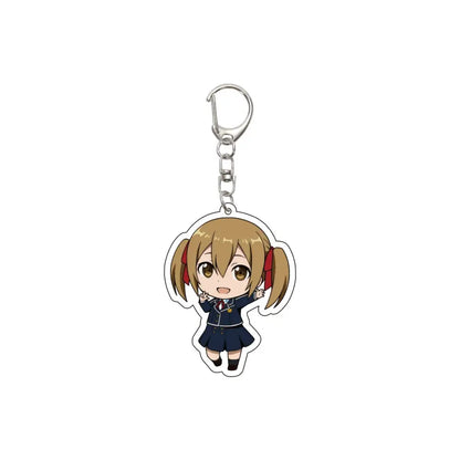 Chibi-style acrylic keychain of blonde anime girl in navy blue uniform with red ribbons attached to silver metal clip