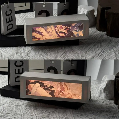 A rectangular light gray led bedroom decor lamp featuring a glowing anime character with warm orange and purple hues motion light box