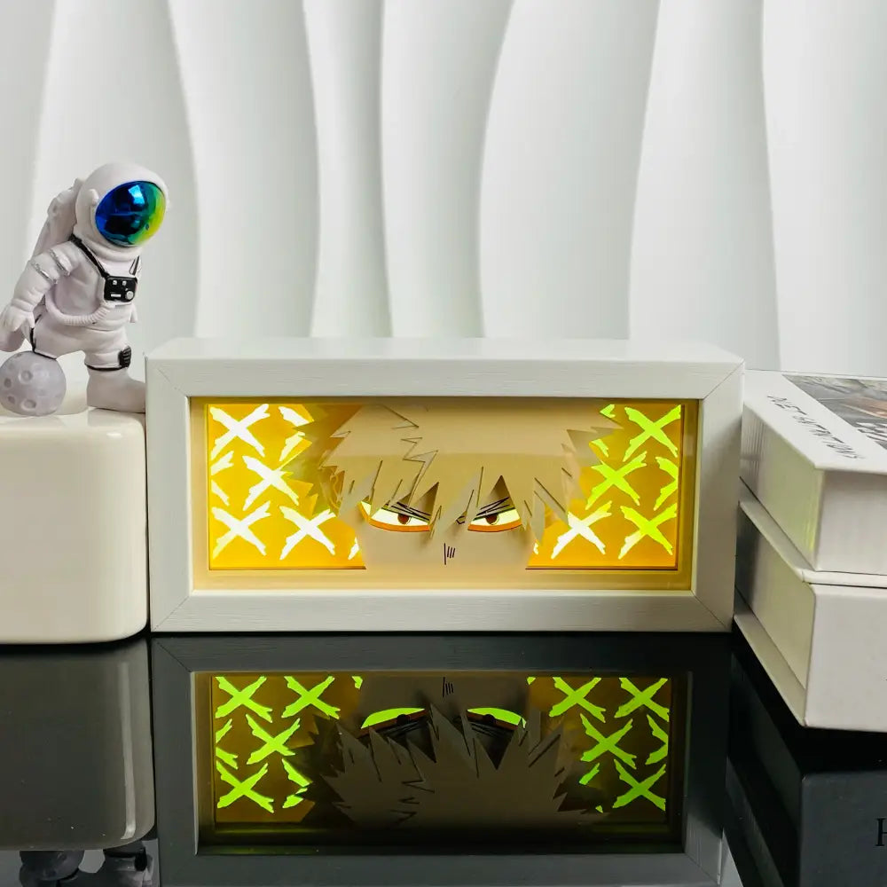 White rectangular led light box with glowing yellow and green anime character face in 3d paper carved lamp design
