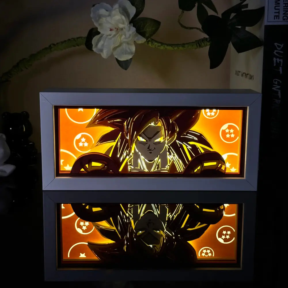 Anime 3D paper carved lamp led light box featuring glowing orange super saiyan goku cutout and white dragon ball borders