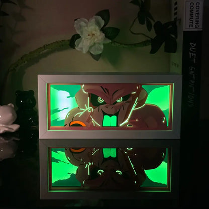 Anime 3d paper carved lamp led light box with a glowing green-lit angry face design and white frame