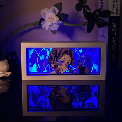 White-framed illuminated anime 3d paper carved lamp with blue led backlighting and butterfly motifs in display box