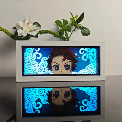 White-framed anime 3d paper carved lamp with glowing blue character red hair and stylized cloud patterns illuminated