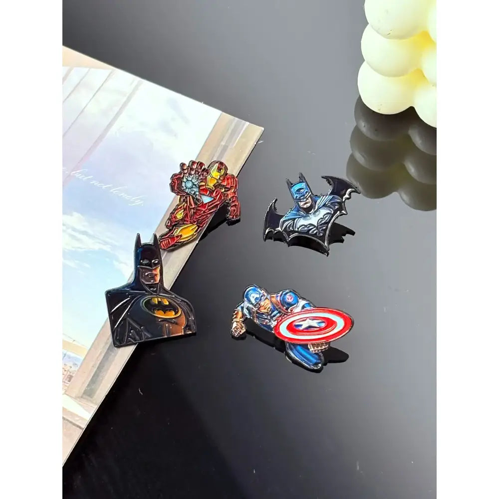 Set of four colorful cartoon anime enamel pins featuring batman iron man captain america and bat-shaped design metal brooch