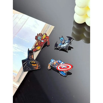 Set of four colorful cartoon anime enamel pins featuring batman iron man captain america and bat-shaped design metal brooch