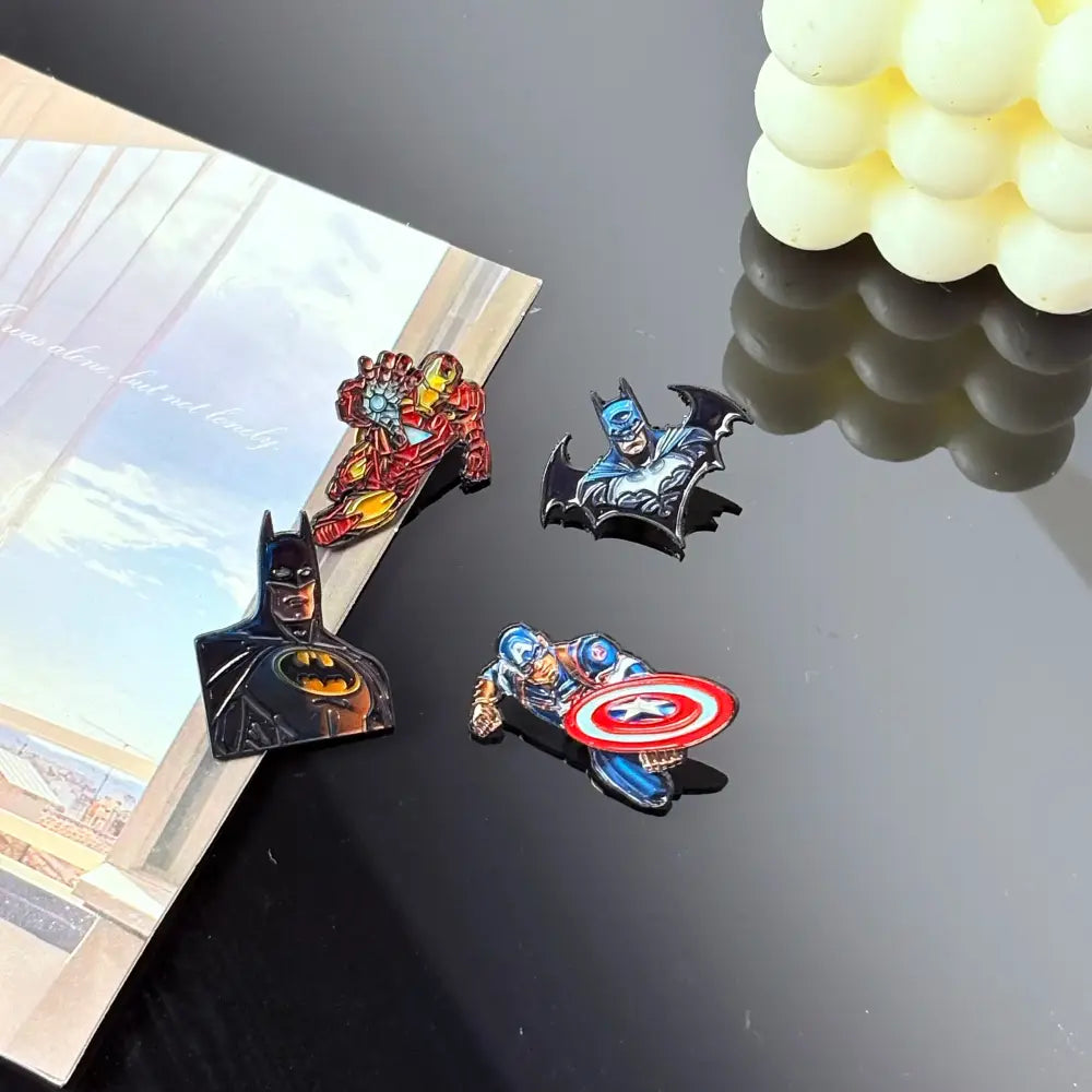 Set of four colorful enamel pins featuring iron man batman and captain america cartoon anime badge designs