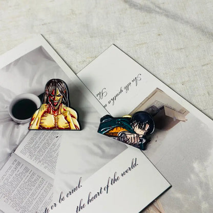 Two colorful anime boy enamel pins featuring a female in yellow armor and a male in green outfit fashion brooch badge