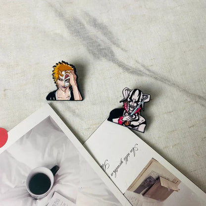 Two anime boy enamel pins featuring spiky orange hair and white black outfit characters in fashion brooch style