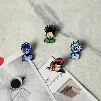 Four colorful anime boy enamel pins featuring hunter x hunter characters with distinct spiky hair and expressions