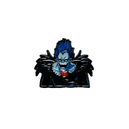 Blue and black anime boy enamel pin featuring ryuk with spiky blue hair glowing yellow eyes and bat wings