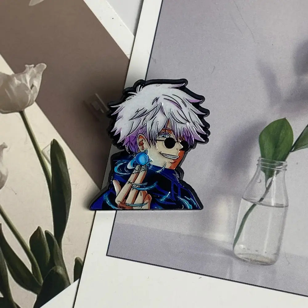 Glossy acrylic anime boy enamel pin featuring a boy with spiky white hair purple highlights and a glowing blue orb
