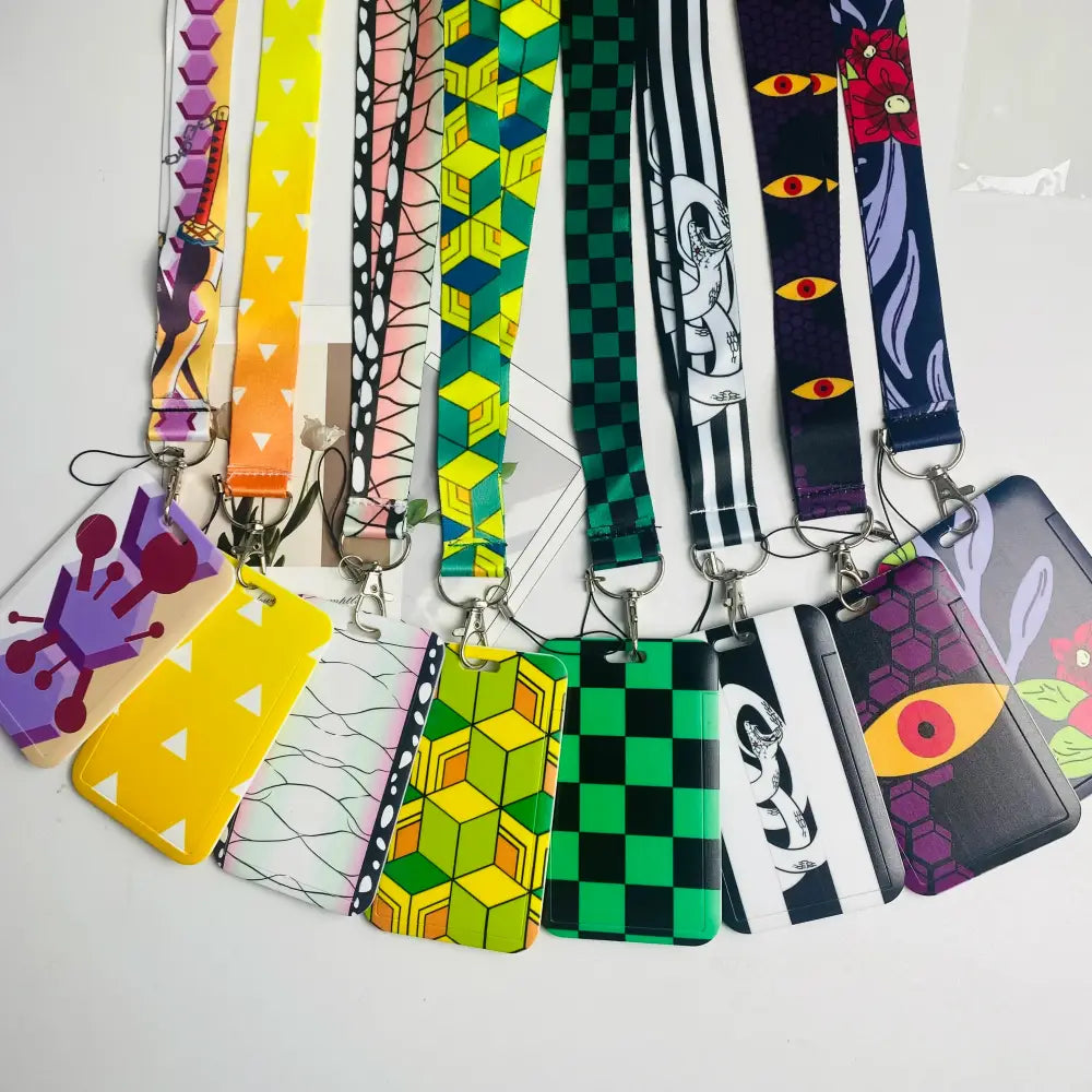 A colorful collection of anime card holder neck straps with matching patterned card holders for id cards