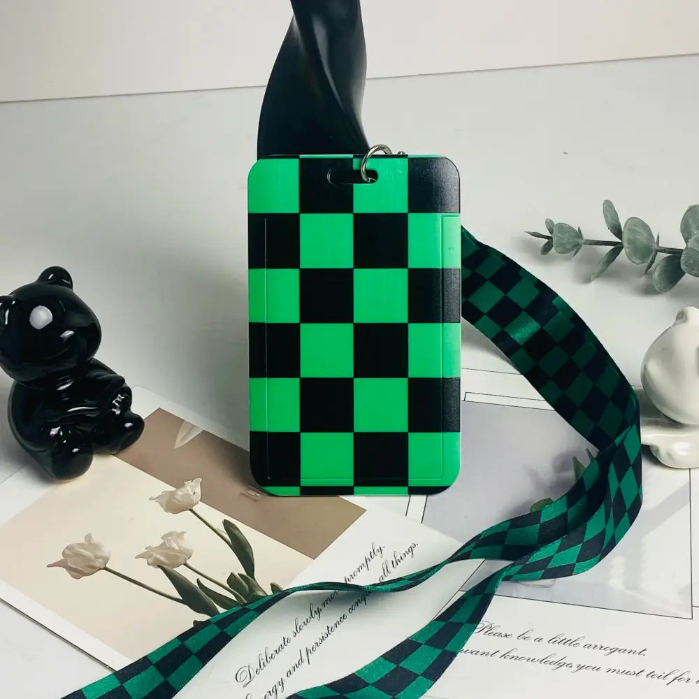 Green and black checkered anime card holder with matching ribbon neck strap for secure id card storage