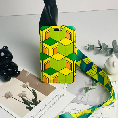 Vibrant geometric-patterned anime card holder neck strap with bold yellow green and orange 3d cube design