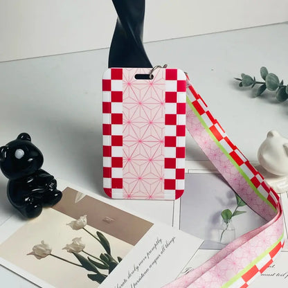Anime card holder lanyard with a red and white checkered neck strap and pink geometric pattern card holder strap