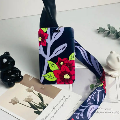 Anime card holder neck strap in navy blue with a vibrant floral pattern featuring red flowers and green leaves