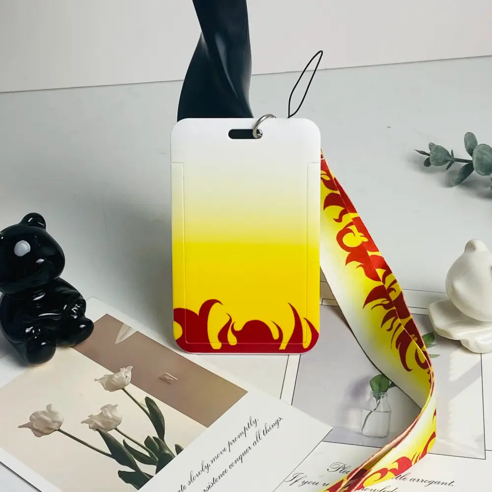 Anime card holder with white and yellow gradient and red flame design featuring a matching neck strap