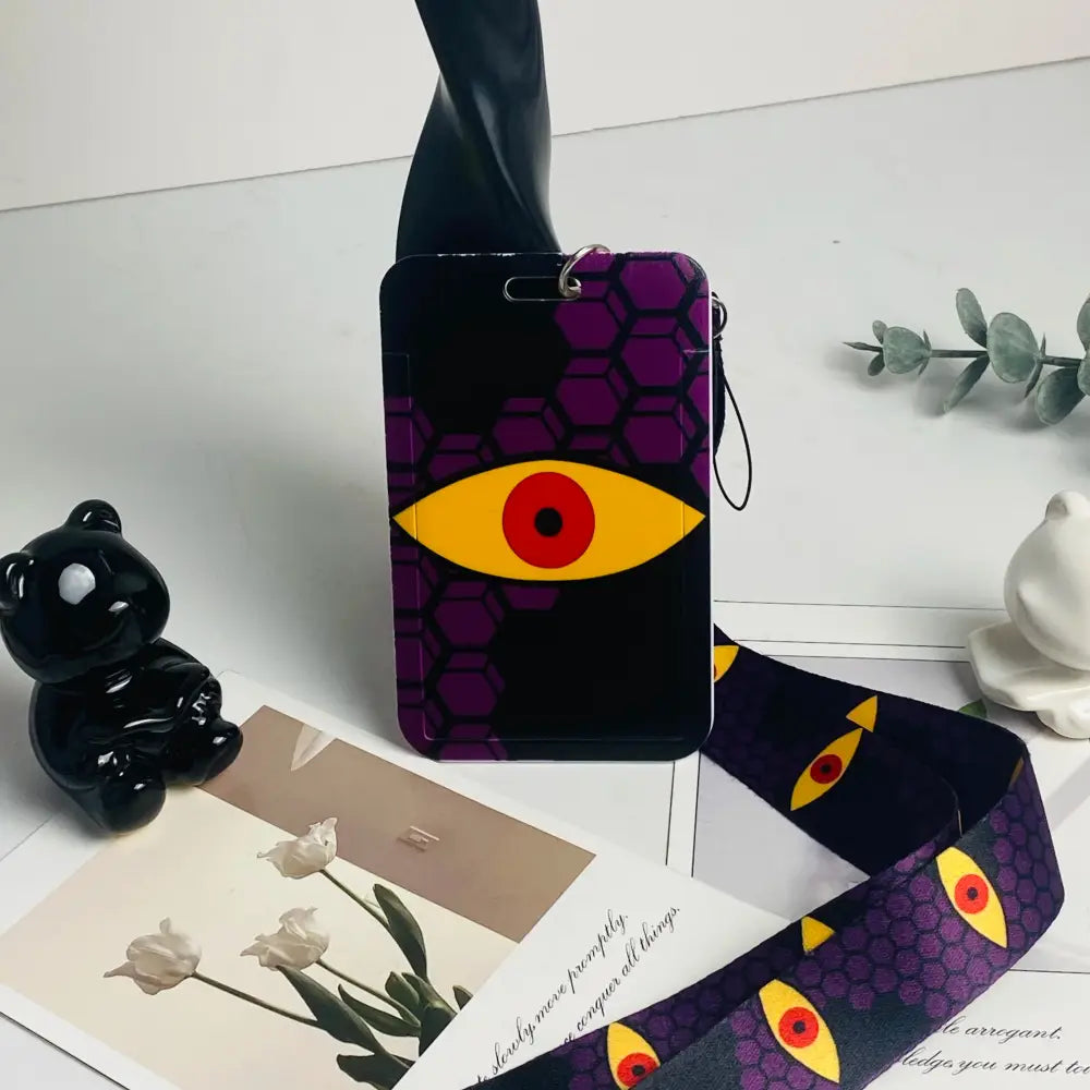 Anime card holder neck strap with purple and black hex pattern and yellow eye design red pupil id card holder