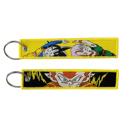 Yellow and black embroidered key fob featuring dragon ball characters with a silver metal ring key tag keychain