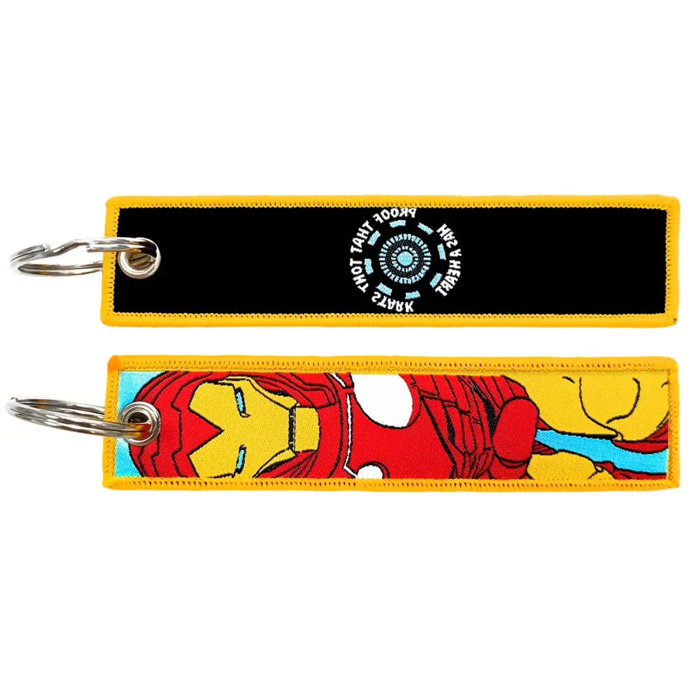 Two embroidered key fobs featuring iron man arc reactor and red gold suit designs on black and yellow backgrounds key tag